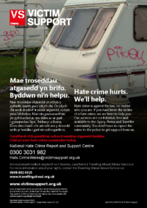 Victim support poster with pikey graffiti on caravan